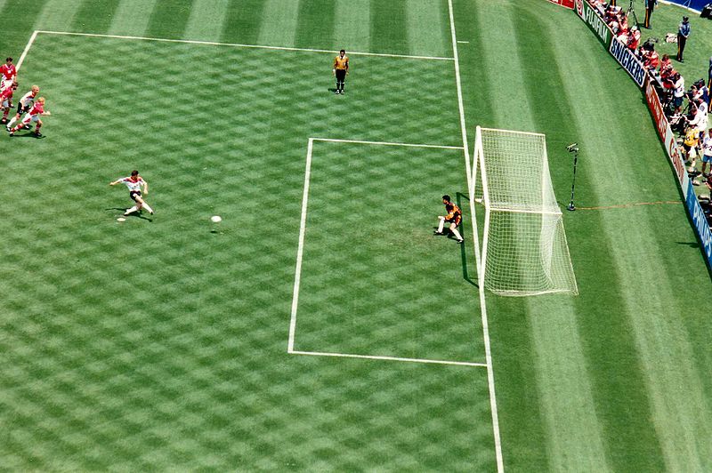 Matthäus scores a penalty kick against Bulgarian goalkeeper Borislav Mihaylov in the 1994 World Cup quarter-final